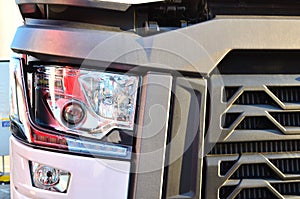 Frontal lighting products for on-highway vehicles, which includes integrated daytime running lights and beam patterns. Bi-Xenon