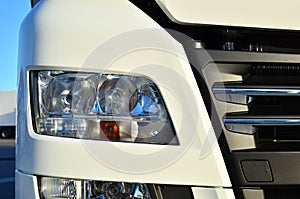 Frontal lighting products for on-highway vehicles, which includes integrated daytime running lights and beam patterns. Bi-Xenon