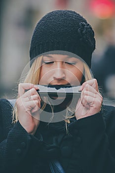 Woman playing harmonica