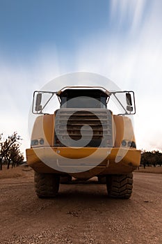 Frontal view of a dump truck parked at the construction site