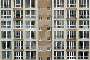 Frontal view of the facade of building with a lot of windows