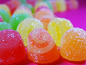 Gummies candy on a ondulated pattern closeup pattern