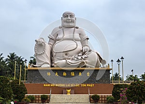 Frontal view on massive white Sitting Buddha statue, Vietnam.
