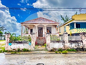 frontal view of an old colorful abandoned city villa