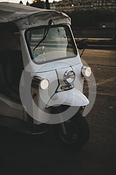 Frontal view of a white Piaggio Ape