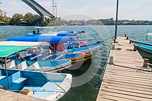 FRONTERAS, GUATEMALA - MARCH 10, 2016: Boats at Rio Dulce river at the pier in Fronteras town, Guatema