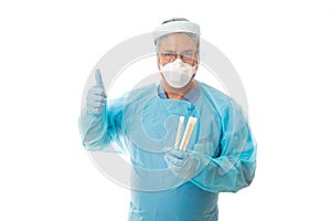 Frontline health worker holding swabs for COVID-19 coronavirus or influenza photo