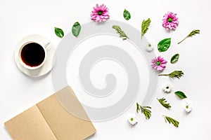 Froral flat lay with cup and notepaper top view mockup