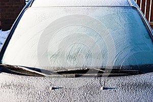 Frost on a completely covered car windscreen