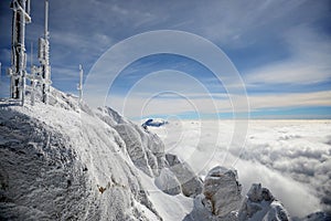 Frost covered antennas on top of the Alps