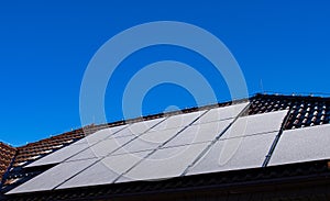 Frost covering solar panels on sunny day