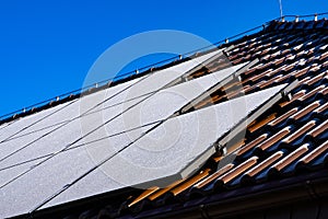 Frost covering solar panels on sunny day