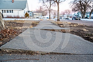 Frost heave crack in residential concrete sidewalk