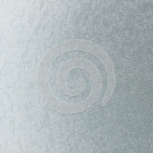 Frost on the metal surface of the car with a gray blur effect. Abstract background and texture for design.