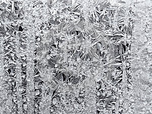 frost pattern on window glass closeup in winter