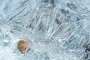 Frost patterns on ice surface. River covered with ice