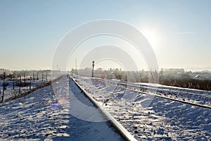The frost railway under noon sun