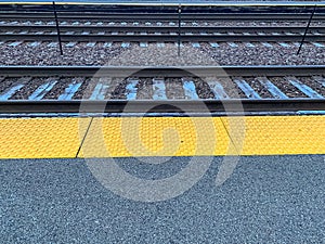 Frost settles on railroad tracks along station platform