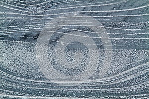 Frost streaks on dark ice