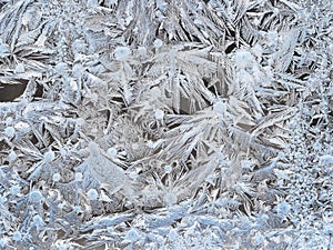 frost on surface of window glass closeup in winter