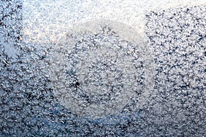 frost on window of apartment on cold winter dusk