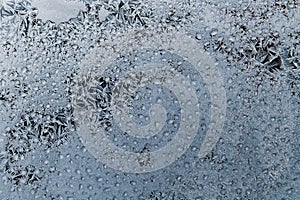 Frost on the window glass. Frozen drops