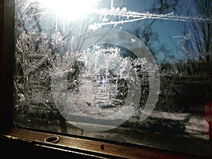 Frost on Window Pane with Sunlight Shining