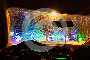 Frosted car glass. snow covered car windshield