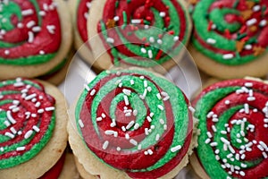 Frosted Christmas sugar cookies, homemade with green and red swirled buttercream frosting