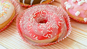 Frosted donuts with colorful sprinkles