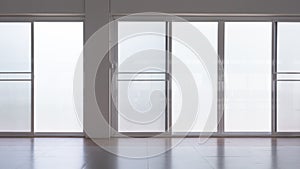 Frosted glass sliding doors with screen doors and light reflection on tile floor surface in empty room