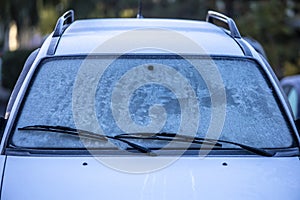 Frosted ice on car windscreen in winter