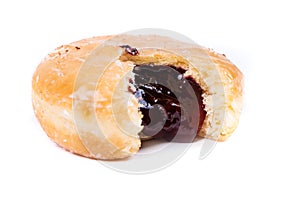 Frosted jelly filled donut with a bite out of it