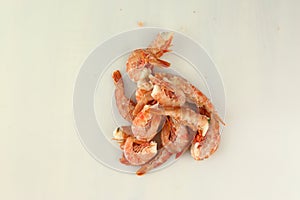 frosted king prawns closeup photo on white table background