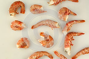 frosted king prawns closeup photo on white table background