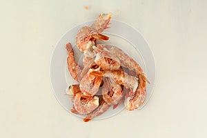 frosted king prawns closeup photo on white table background