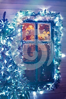 Frosted window with Christmas decoration