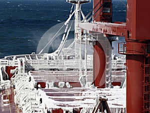 Frosting a cargo ship in a stormy sea