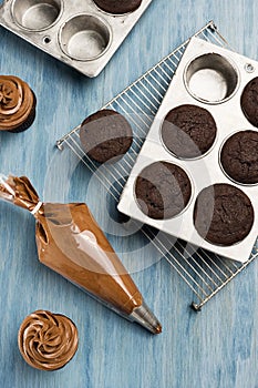 Frosting Cooled Chocolate Cupcakes