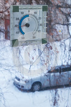 Frosts in Siberia town Novosibirsk. Thermometer out the window at minus 33 degrees centigrade photo