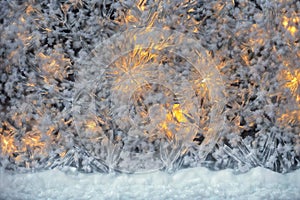 Frostwork. Close up of snowflakes and frost on the window glass. Winter background.