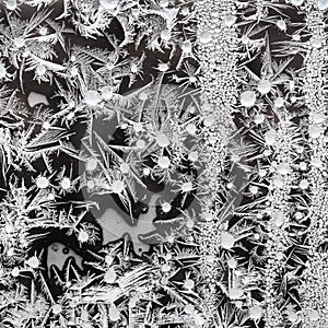 frostwork on window glass closeup in winter