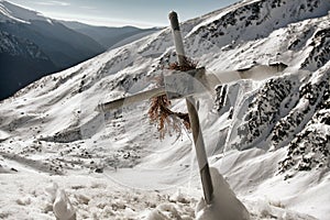 Frosty Cross on Snowy Mountains