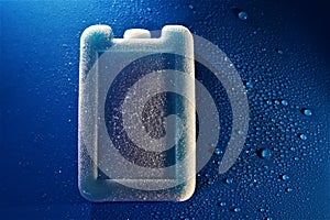 Frosty frozen iced pack water droplets blue background