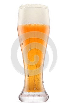 Frosty glass of fresh light beer with bubble froth isolated on white background