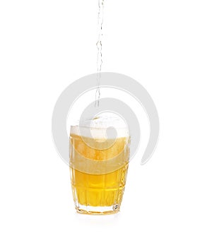 Frosty glass of light beer set isolated on a white background