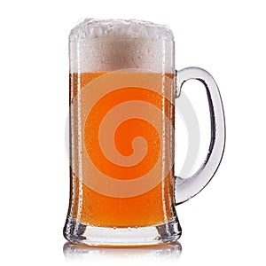 Frosty glass of unfiltered beer on a white background photo