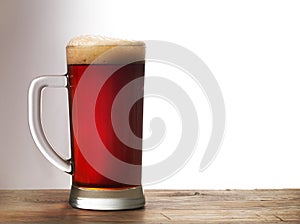 Frosty mug of dark beer