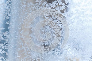 Frosty pattern on the glass. The figure is made of cold air