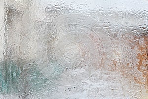 Frosty pattern on glass winter window, look through glass